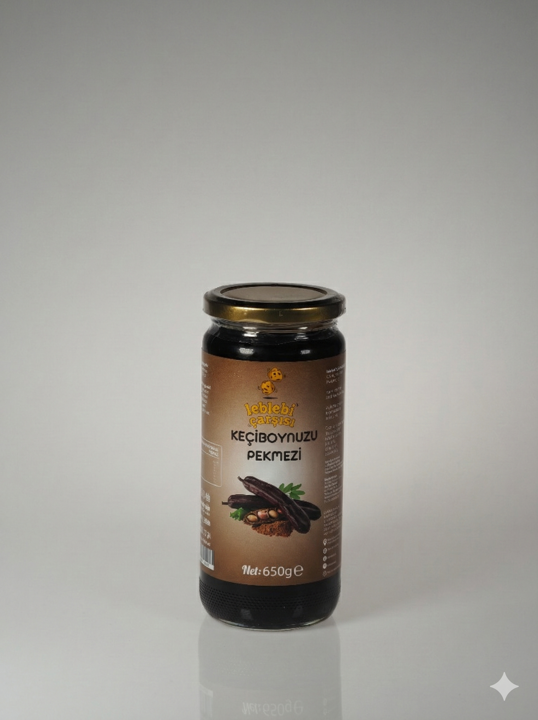 Keçiboynuzu Pekmezi – Cam kavanozda sunulan koyu kıvamlı, katkısız ve doğal pekmez görüntüsü