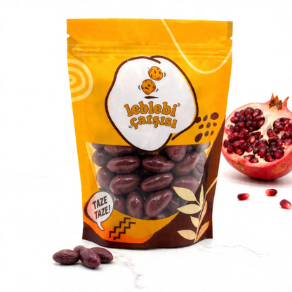 Nar aromalı beyaz çikolata ile kaplanmış pütürlü yüzeyli badem drajeler